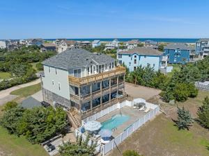 an aerial view of a house with a swimming pool at Little Cayman in Salvo
