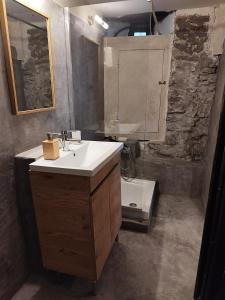 a bathroom with a sink and a shower at Kamara 1898 katoi in Mouresi +15 photos