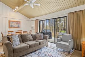 a living room with a couch and a chair at Sanctuary at Sundendorf- New Updates! in Bellaire