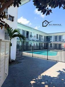 a building with a swimming pool in front of a building at Modern studio in a prime location 112-1 in Hollywood