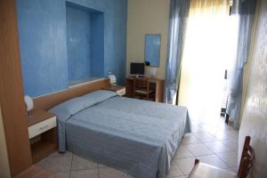 Postel nebo postele na pokoji v ubytování il portico dei normanni