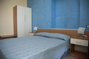 Postel nebo postele na pokoji v ubytování il portico dei normanni