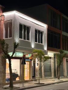 a building on the side of a street at night at Logan Rooms Berat in Berat
