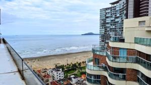 a view of the beach from the balcony of a building at Stay Inn Santos in Santos