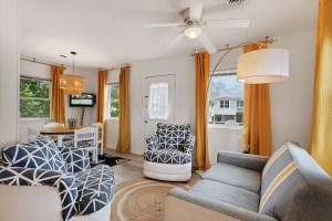 a living room with two couches and a table at 5041 - The Captains Quarters in Kill Devil Hills