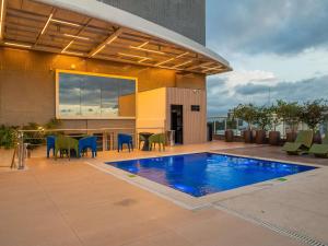 a swimming pool on the roof of a building at Ibis Styles Belém Hangar in Belém