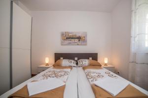 Posteľ alebo postele v izbe v ubytovaní Apartments Kati