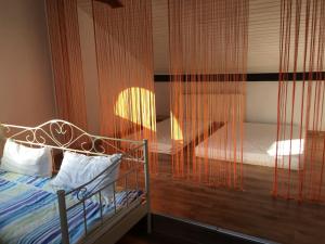 a bedroom with a bed with a glass wall at Train Fans in Seevetal