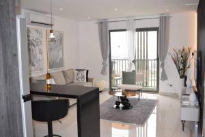a living room with a couch and a table at Loxwood by Tripview Apartments in Accra