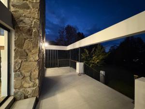a balcony of a house at night at Nest On Thula in Dullstroom