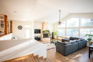 a living room with a couch and a fireplace at Private Luxury Getaway | Fire Pit | Near Weddings in Dripping Springs