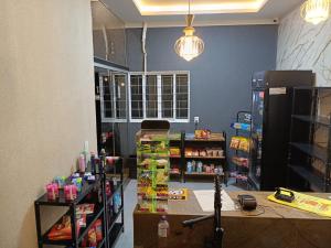 a room with a grocery store with a lot of products at FlatsMedrado Hotel in Confresa