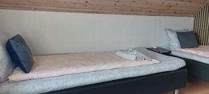 a room with a large bed with at Venos rooms in Hirtshals