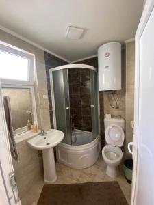 a bathroom with a shower toilet and a sink at RISTESKI GUEST HOUSE in Ohrid +29 photos