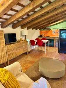 a living room with a couch and a tv at Can Petitu in Amer