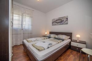 Posteľ alebo postele v izbe v ubytovaní Apartments Kati