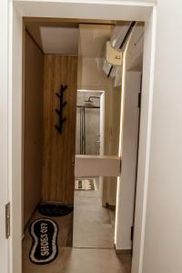 a hallway with a stairway leading to a room at VIP Apartman Friendly Home in Tuzla +12 photos