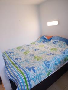 a bedroom with a bed with a blue comforter at Luki's Apartment in Horn-Bad Meinberg