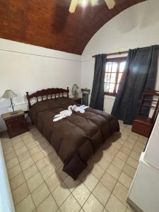 a bedroom with a large bed in a room at Cabañas Las Lomas in Juana Koslay  +19 photos
