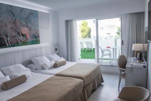 Postel nebo postele na pokoji v ubytování Villa Luz Design & Art Hotel