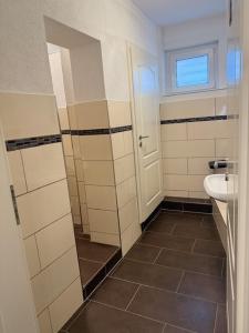 a bathroom with a sink and a toilet at Campus Hotel - ehemals Hotel Paseo in Aachen