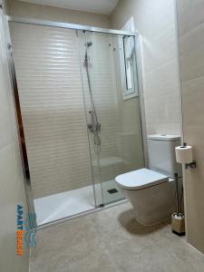 a shower stall in a bathroom with a toilet at APARTBEACH BALANDRO VISTAS MAR in Cambrils