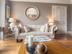 a living room with a couch and a table at Somerton House Rooms Only in Belfast