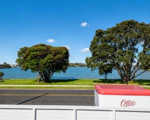 a view of a body of water with trees at Tauranga Backpackers - Private Guest Rooms by the Water! in Tauranga +6 photos