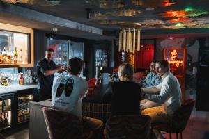 a group of people sitting at a bar at MyGoodLife Hotel & Bar in Gerlos