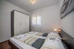 Posteľ alebo postele v izbe v ubytovaní Apartments Kati