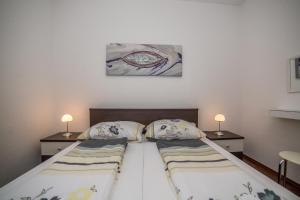 Posteľ alebo postele v izbe v ubytovaní Apartments Kati