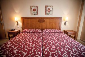 Postel nebo postele na pokoji v ubytování Gran Hotel Ciudad Del Sur