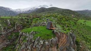 a small chapel on the side of a mountain at SapsanLodge in Artabuynkʼ