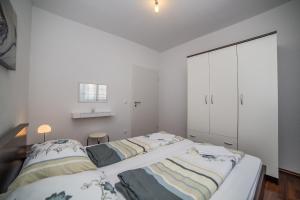 Posteľ alebo postele v izbe v ubytovaní Apartments Kati