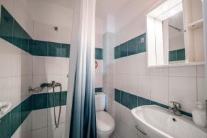 a bathroom with a toilet and a sink at Kalpazo Rental Kaya Stays in Golem