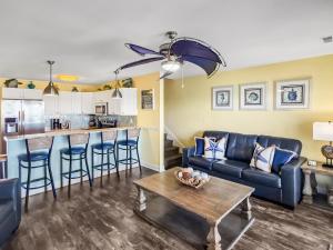 a living room with a couch and a table at Put-in-Bay Waterfront Condo #207 in Put-in-Bay