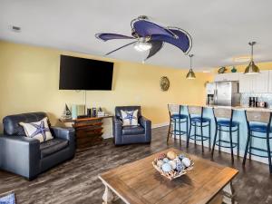 a living room with a couch and a table at Put-in-Bay Waterfront Condo #207 in Put-in-Bay +26 photos