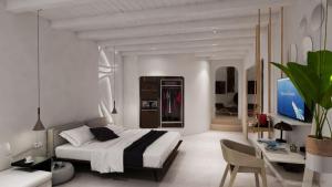 A bed or beds in a room at Absolute Mykonos Suites & More Még 37 kép