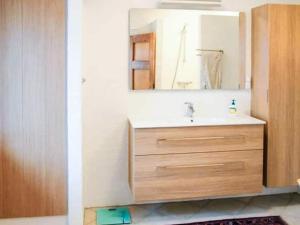 a bathroom with a sink and a mirror at 4 star holiday home in Hornsyld in Hornsyld +30 photos