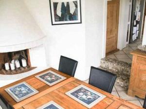 a dining room with a table and chairs and a fireplace at 4 star holiday home in Hornsyld in Hornsyld