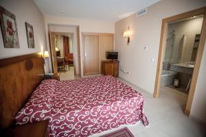 Postel nebo postele na pokoji v ubytování Gran Hotel Ciudad Del Sur