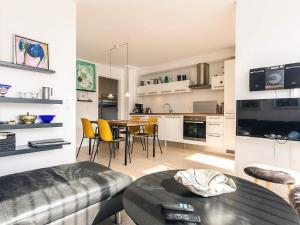 a living room and kitchen with a table and chairs at 4 person holiday home in Bogense-By Traum in Bogense