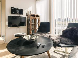 a living room with a table and two chairs at 4 person holiday home in Bogense-By Traum in Bogense