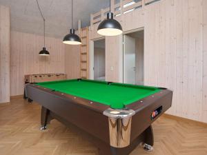 a pool table in a room with a green at 5 star holiday home in Haderslev in Haderslev