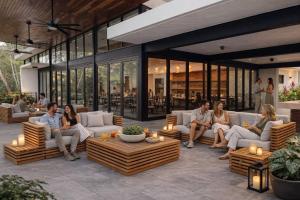 a group of people sitting on a patio at Modern Villa Overlooking Macal River Valley in Benque Viejo del Carmen