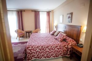 Postel nebo postele na pokoji v ubytování Gran Hotel Ciudad Del Sur