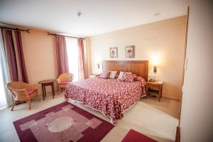 Postel nebo postele na pokoji v ubytování Gran Hotel Ciudad Del Sur