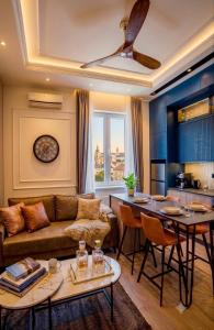 a living room with a couch and a table at Miha Premium Apartment 2BR 50m from Main Square in Belgrade