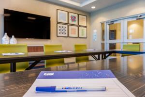 a pen sitting on top of a table in a classroom at Holiday Inn Express & Suites - Phoenix Dwtn - State Capitol by IHG in Phoenix +87 photos