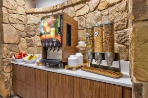 a kitchen with a counter with food on it at Holiday Inn Express Marble Falls by IHG in Marble Falls